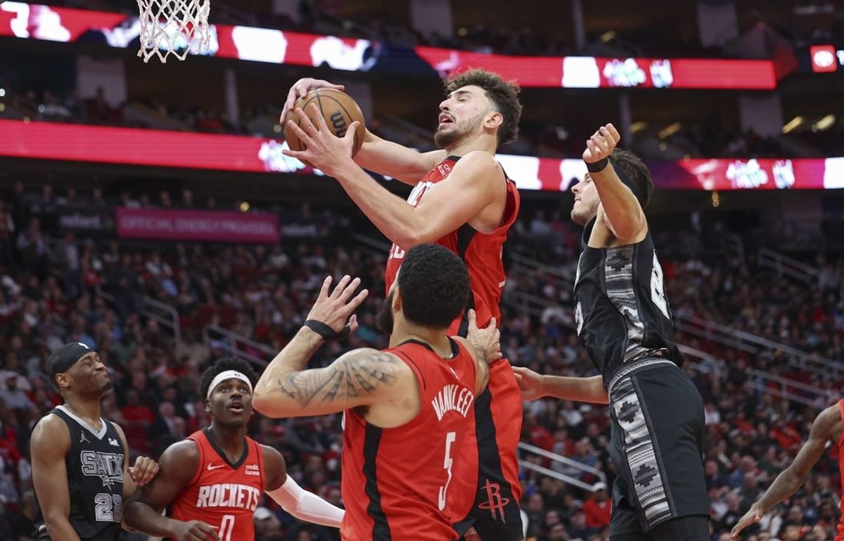 Dec 11, 2023; Houston, Texas, USA; Houston Rockets center Alperen Sengun (28) grabs a rebound during the third quarter against the San Antonio Spurs at Toyota Center.
