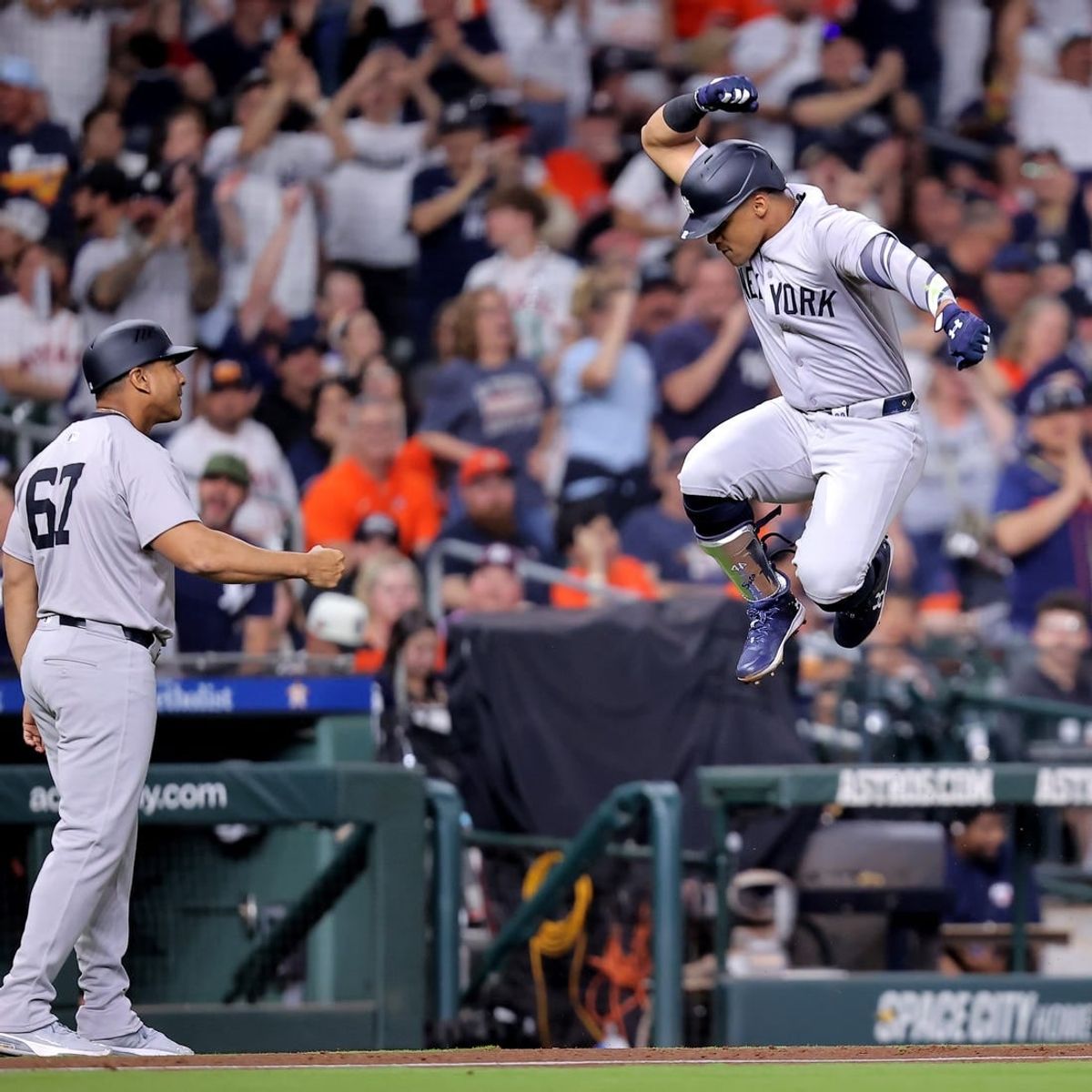 Mar 30, 2024; Houston, Texas, USA; New York Yankees right fielder Juan Soto (22, right) reacts after hitting a home run to left field against the Houston Astros during the seventh inning at Minute Maid Park.