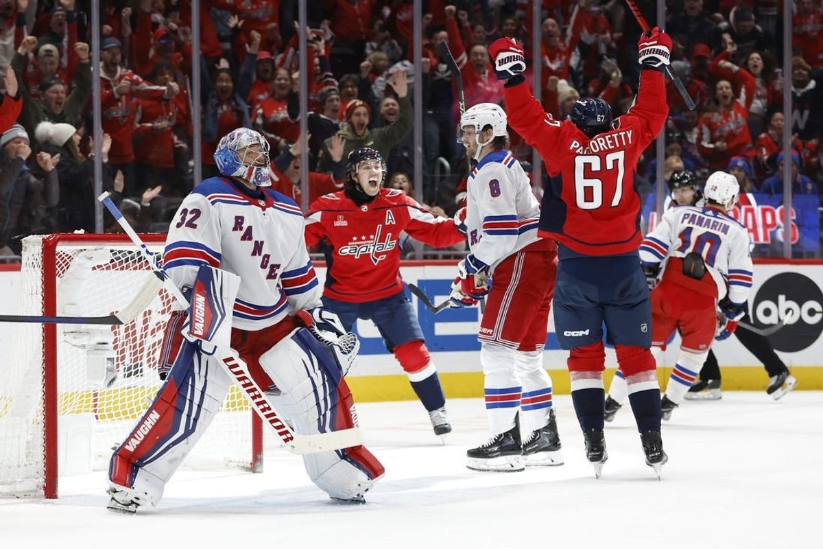 Jan 13, 2024; Washington, District of Columbia, USA; Washington Capitals right wing T.J. Oshie (77) celebrates with Capitals left wing Max Pacioretty (67) after scoring a goal on New York Rangers goaltender Jonathan Quick (32) in the third period at Capital One Arena.