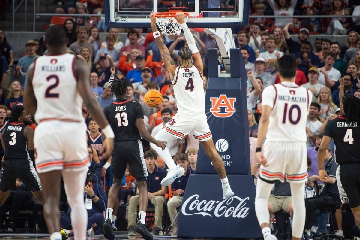 Auburn Tigers forward Johni Broome (4) dunks the ball as Auburn Tigers take on Georgia Bulldogs at Neville Arena in Auburn, Ala., on Saturday, March 9, 2024.
