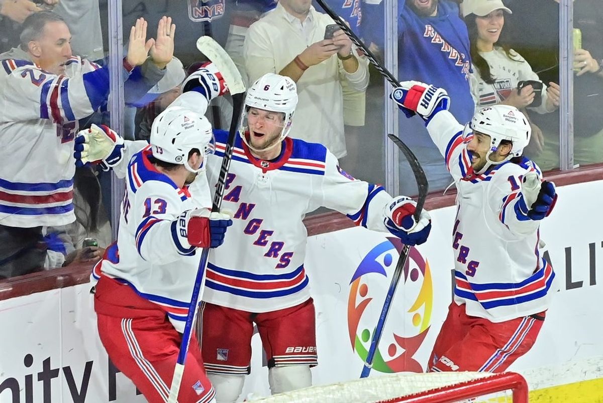 Mar 30, 2024; Tempe, Arizona, USA; New York Rangers defenseman Zac Jones (6) celebrates with left wing Alexis Lafreniere (13) and center Vincent Trocheck (16) after scoring a goal in the third period against the Arizona Coyotes at Mullett Arena.