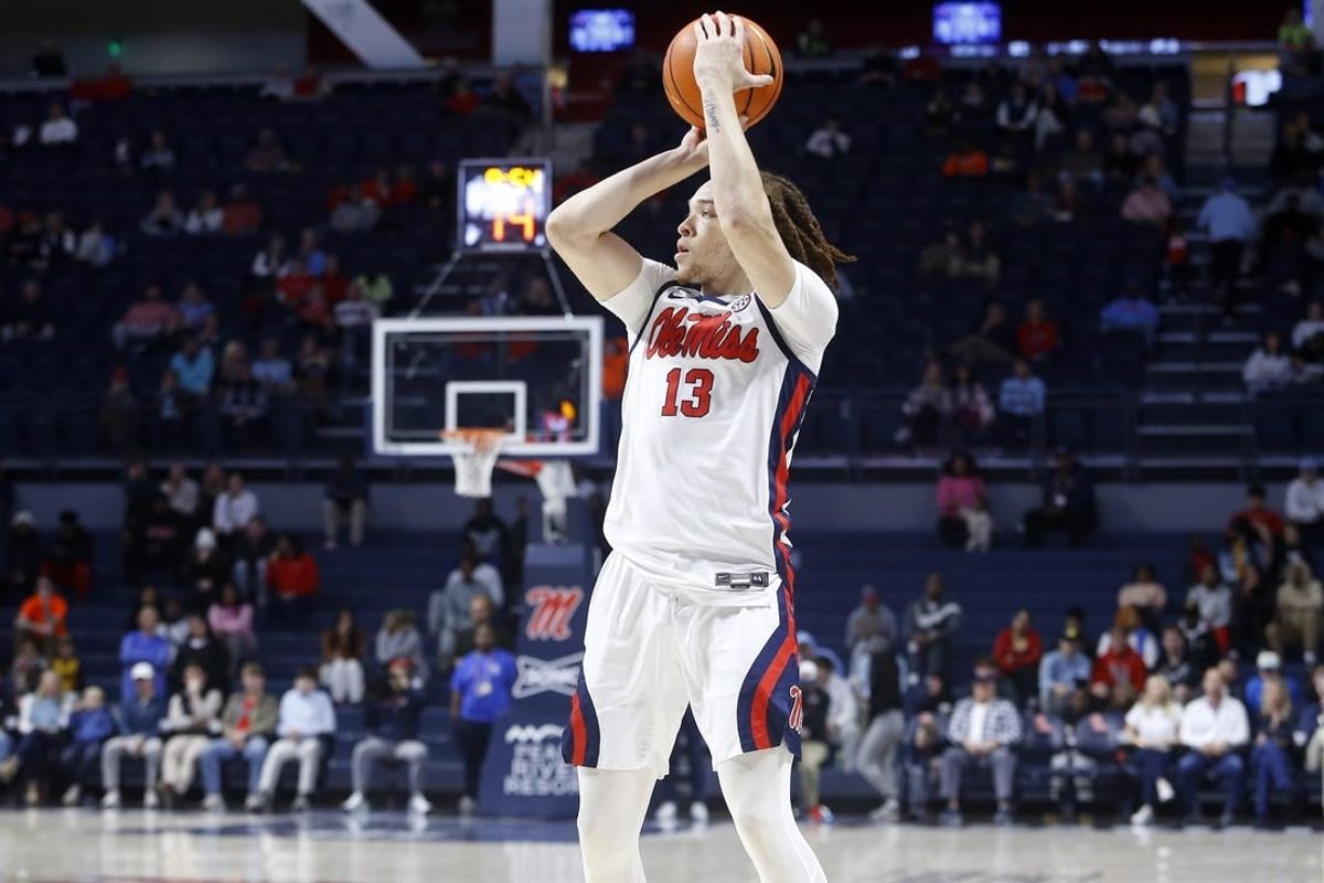 Dec 5, 2023; Oxford, Mississippi, USA; Mississippi Rebels guard Robert Cowherd (13) shoots for three during the first half at The Sandy and John Black Pavilion at Ole Miss.