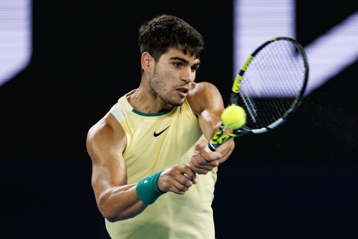 Jan 24, 2024; Melbourne, Victoria, Australia; Carlos Alcaraz of Spain in action against Alexander Zverev of Germany in the quarter final of the men s singles at the Australian Open.