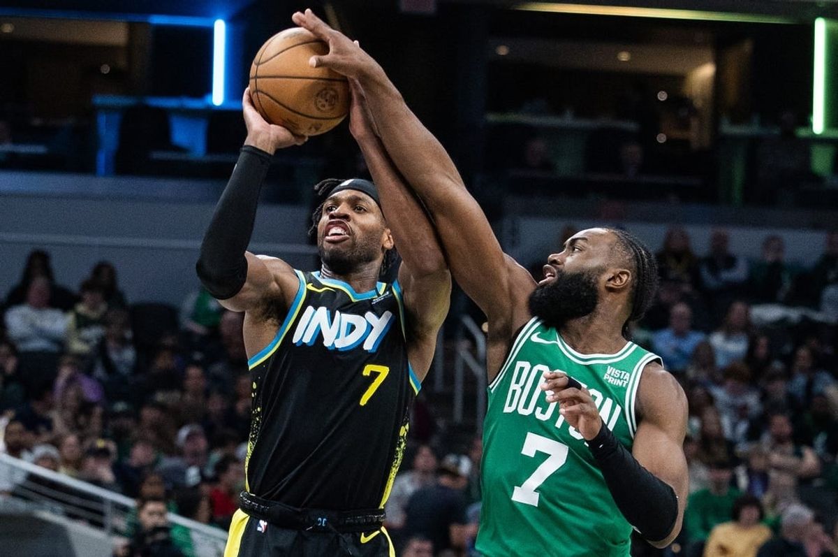 Jan 6, 2024; Indianapolis, Indiana, USA; Boston Celtics guard Jaylen Brown (7) blocks a shot by Indiana Pacers guard Buddy Hield (7) in the second half at Gainbridge Fieldhouse.