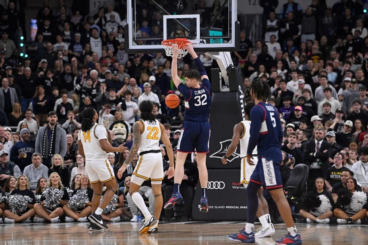 Mar 9, 2024; Providence, Rhode Island, USA: Connecticut Huskies center Donovan Clingan (32) makes a basket against the Providence Friars during the first half at Amica Mutual Pavilion.