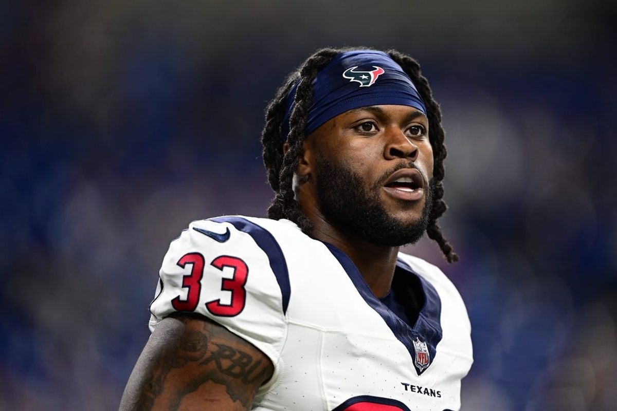 Jan 6, 2024; Indianapolis, Indiana, USA; Houston Texans running back Dare Ogunbowale (33) stands on the field before a game against the Indianapolis Colts at Lucas Oil Stadium.