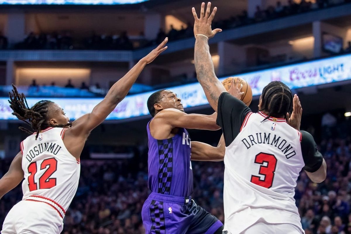 Mar 4, 2024; Sacramento, California, USA; Sacramento Kings guard De'Aaron Fox (5) puts up a shot over Chicago Bulls center Andre Drummond (3) during the second quarter at Golden 1 Center.
