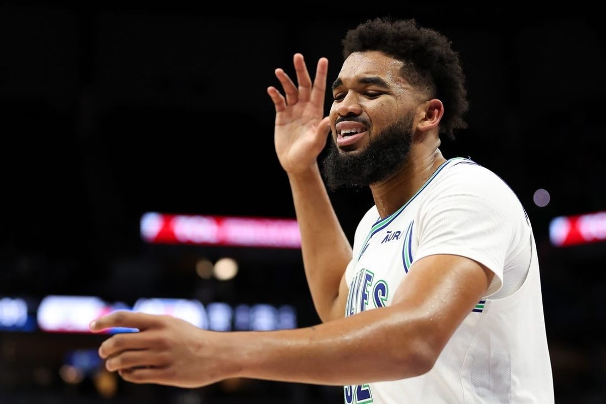 Mar 3, 2024; Minneapolis, Minnesota, USA; Minnesota Timberwolves center Karl-Anthony Towns (32) reacts after being charged with a foul against the LA Clippers during the second half at Target Center.
