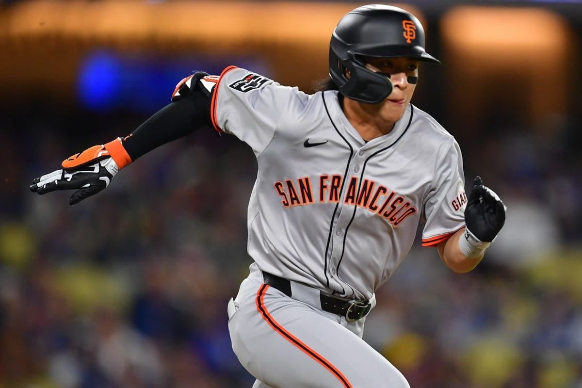 Apr 3, 2024; Los Angeles, California, USA; San Francisco Giants center fielder Jung Hoo Lee (51) runs out a ground ball against the Los Angeles Dodgers during the eighth inning at Dodger Stadium.