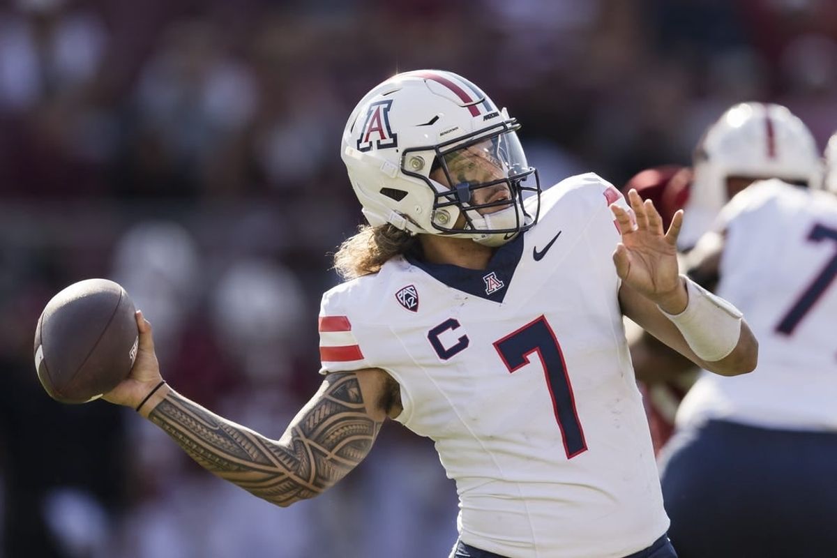 Sep 23, 2023; Stanford, California, USA; Arizona Wildcats quarterback Jayden de Laura (7) passes against the Stanford Cardinal during the first quarter at Stanford Stadium.