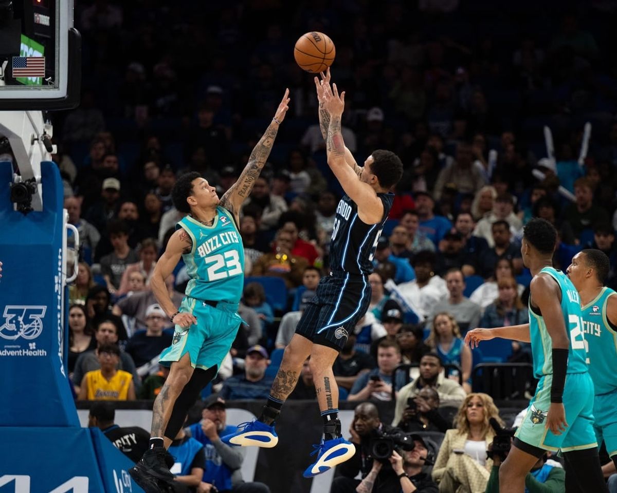 Mar 19, 2024; Orlando, Florida, USA; Orlando Magic guard Cole Anthony (50) shoots the ball over Charlotte Hornets guard Tre Mann (23) in the fourth quarter at KIA Center.