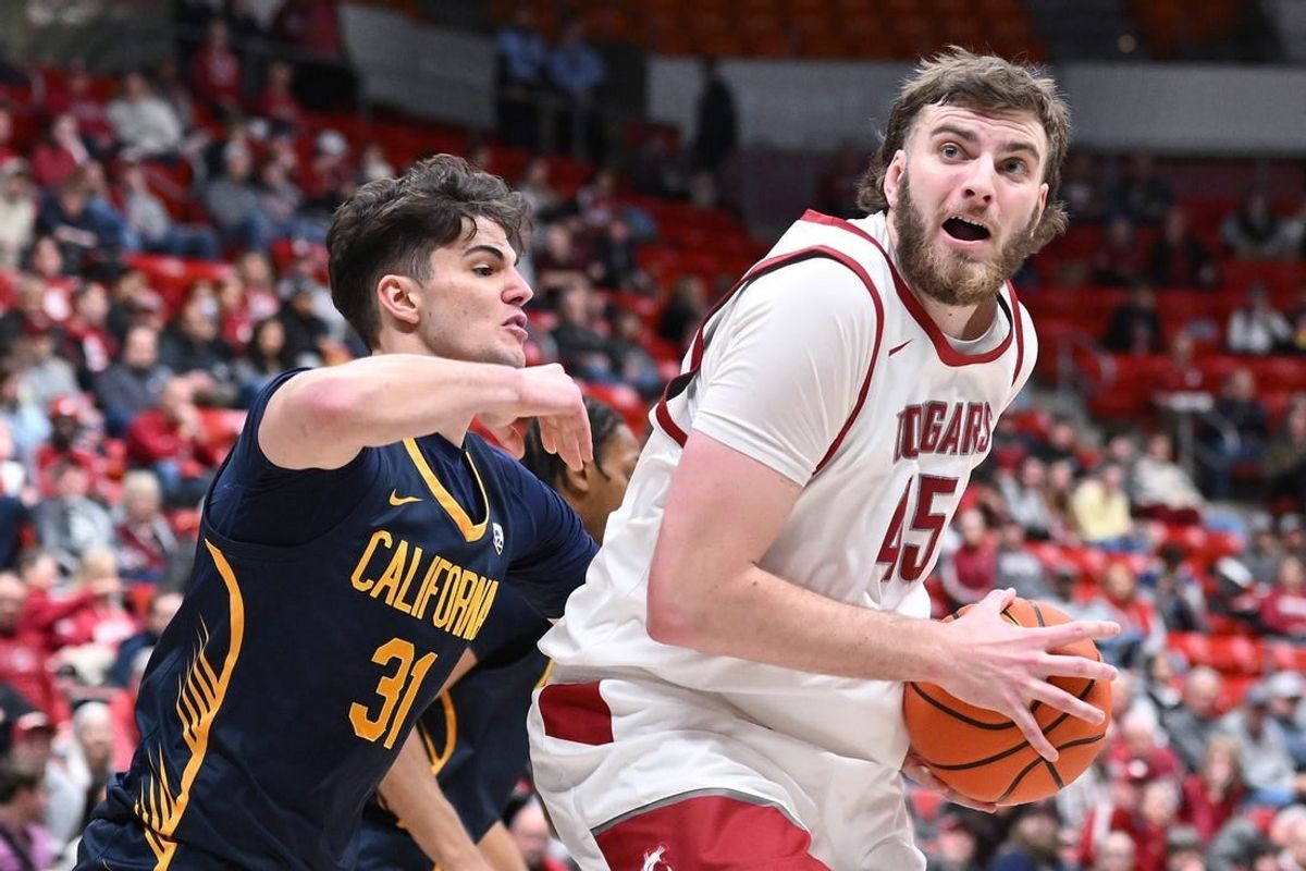 Feb 15, 2024; Pullman, Washington, USA; Washington State Cougars forward Oscar Cluff (45) shoots the ball against California Golden Bears guard Gus Larson (31) in the first half at Friel Court at Beasley Coliseum.