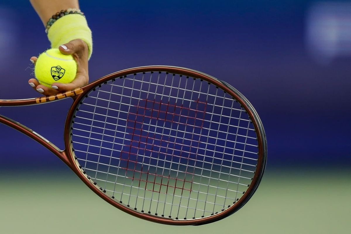 Aug 18, 2023; Mason, OH, USA; A detail view of the ball as Ons Jabeur (TUN) prepares to serve against Aryna Sabalenka during the Western and Southern Open tennis tournament at Lindner Family Tennis Center.