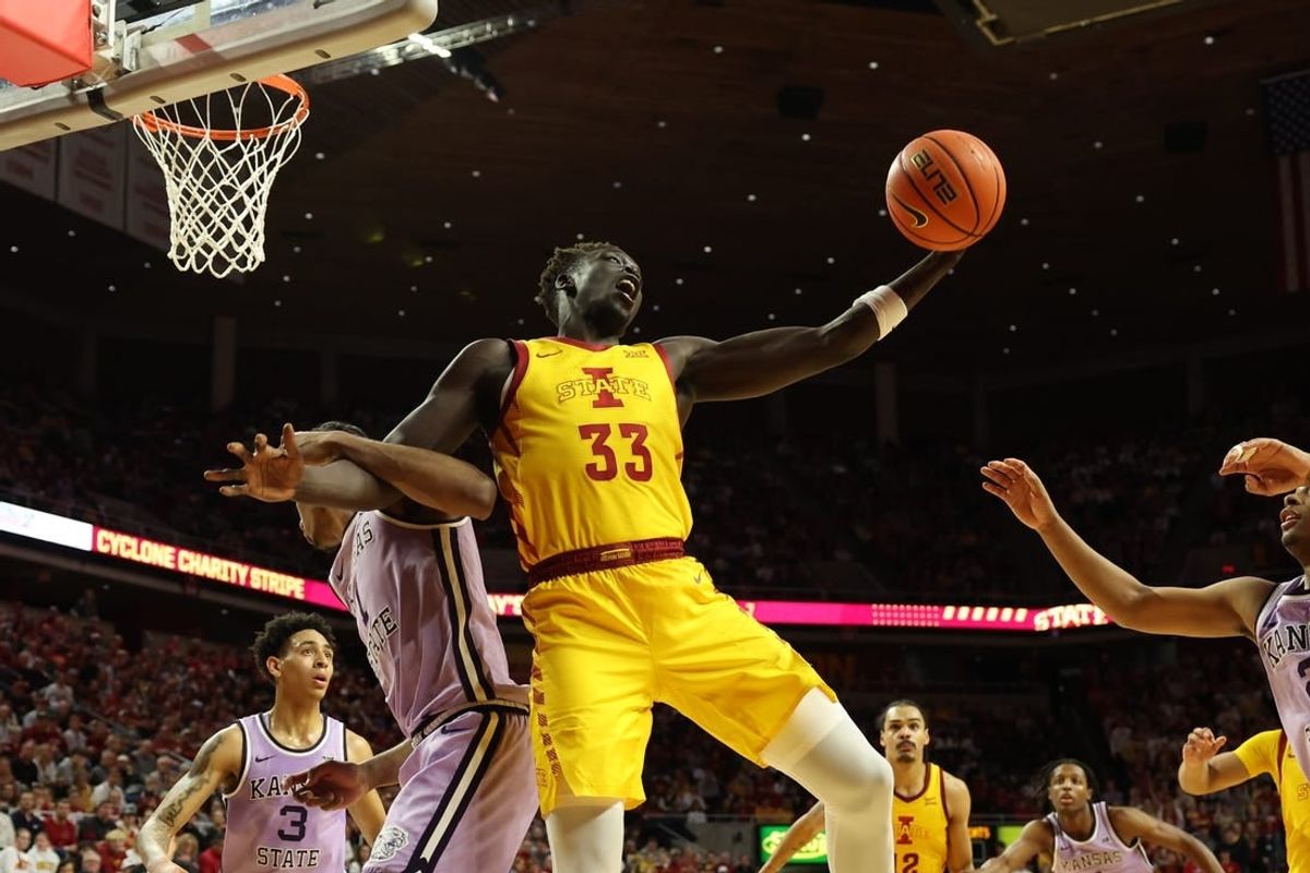 Jan 24, 2024; Ames, Iowa, USA; Iowa State Cyclones forward Omaha Biliew (33) is fouled by Kansas State Wildcats forward David N'Guessan (1) at James H. Hilton Coliseum.