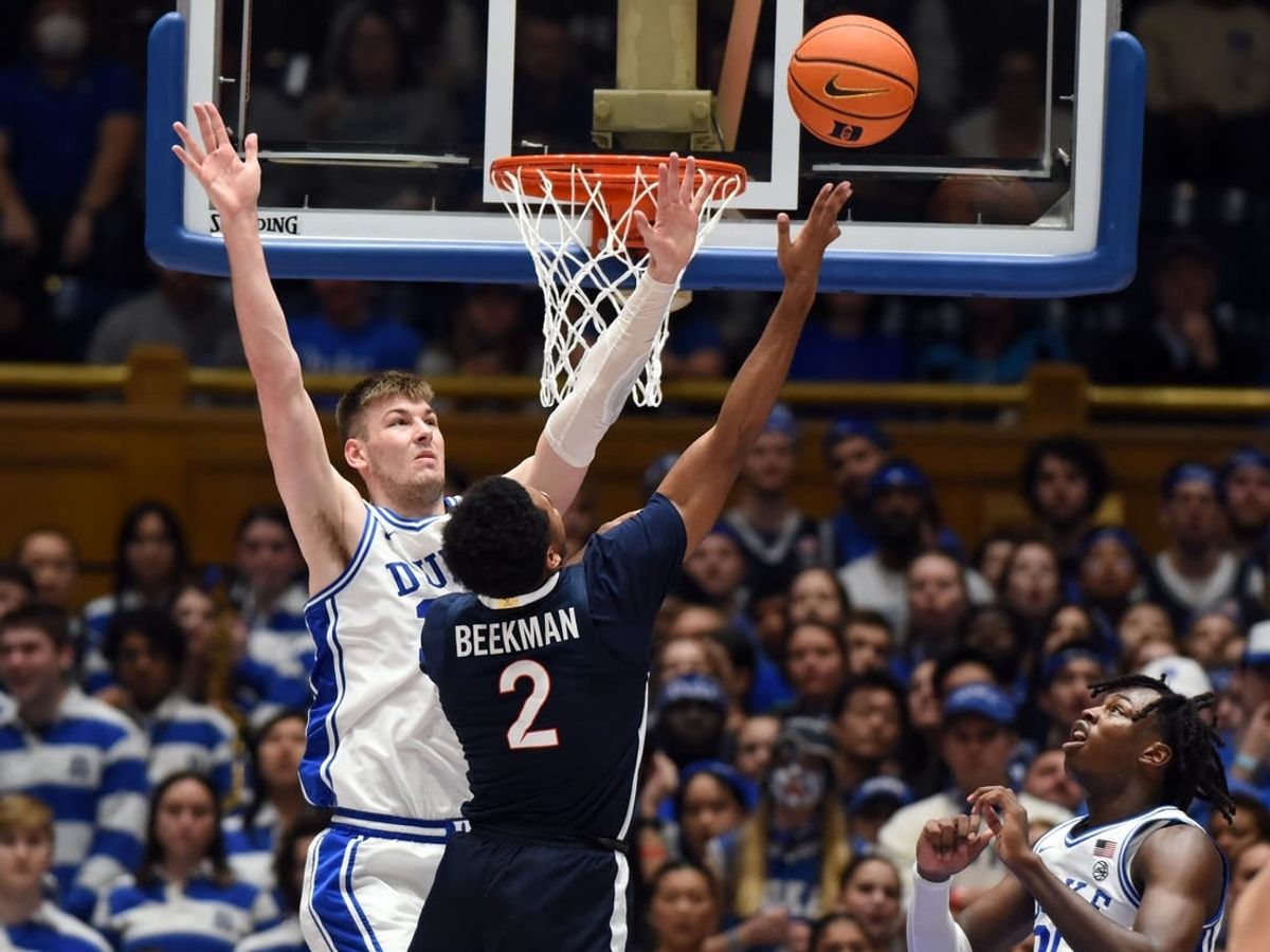 Mar 2, 2024; Durham, North Carolina, USA; Virginia Cavaliers guard Reece Beekman (2) shoots over Duke Blue Devils center Kyle Filipowski (30) during the second half at Cameron Indoor Stadium.