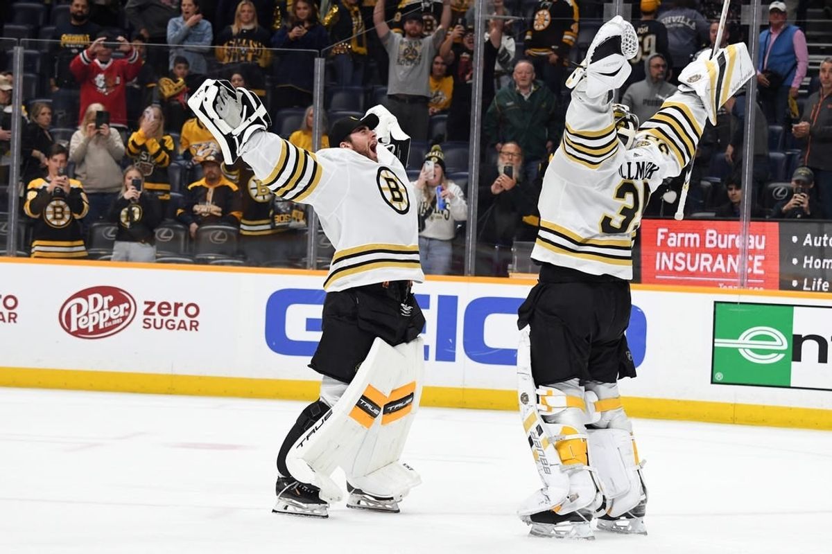 Apr 2, 2024; Nashville, Tennessee, USA; Boston Bruins goaltender Linus Ullmark (35) celebrates with goaltender Jeremy Swayman (1) after a win against the Nashville Predators at Bridgestone Arena.