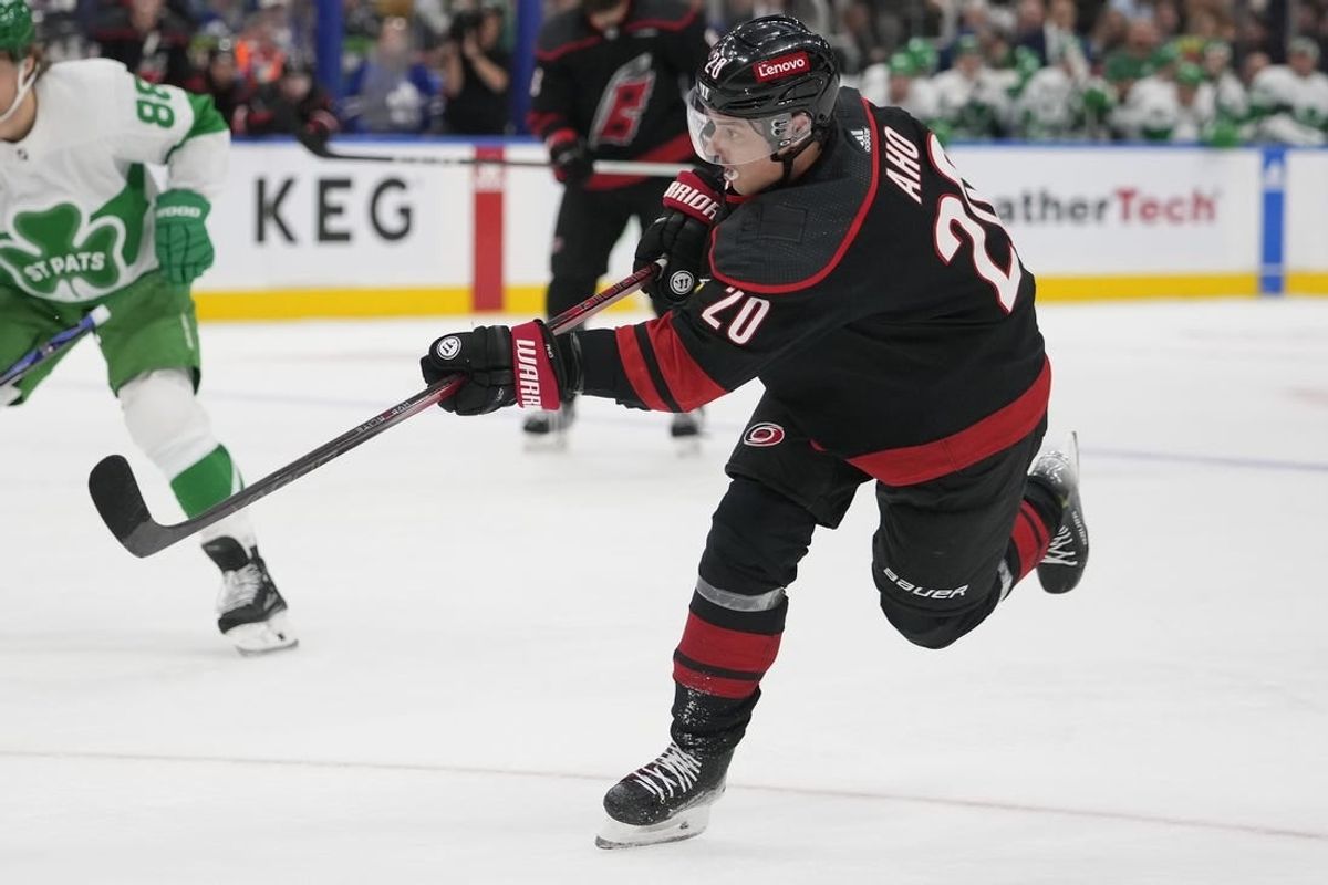 Mar 16, 2024; Toronto, Ontario, CAN; Carolina Hurricanes forward Sebastian Aho (20) shoots the puck against the Toronto Maple Leafs during the second period at Scotiabank Arena.