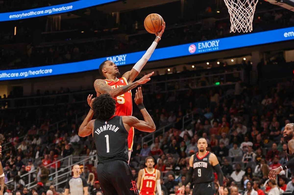 Feb 10, 2024; Atlanta, Georgia, USA; Atlanta Hawks guard Dejounte Murray (5) shoots against the Houston Rockets in the second quarter at State Farm Arena.