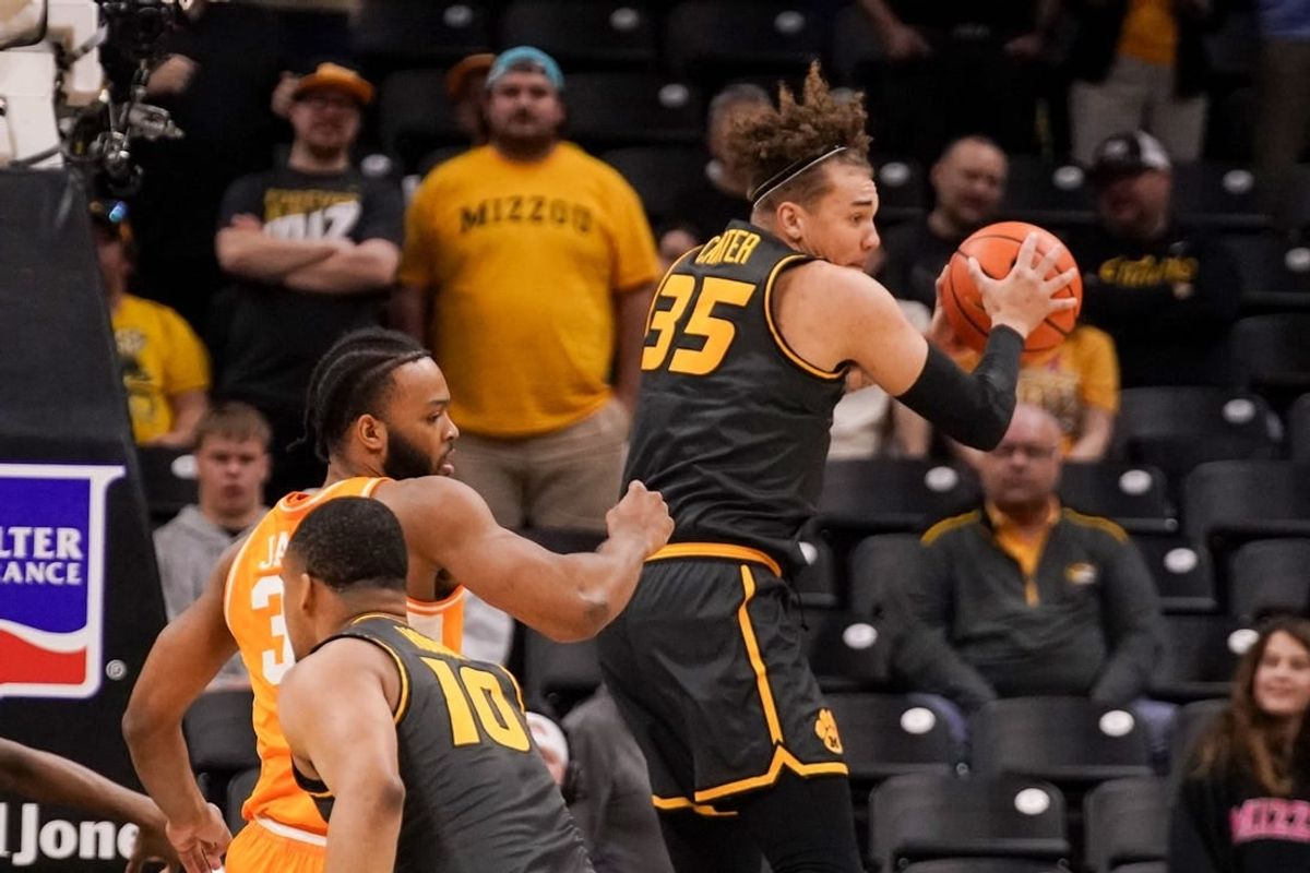 Feb 20, 2024; Columbia, Missouri, USA; Missouri Tigers forward Noah Carter (35) rebounds as Tennessee Volunteers guard Dalton Knecht (3) defends during the first half at Mizzou Arena.