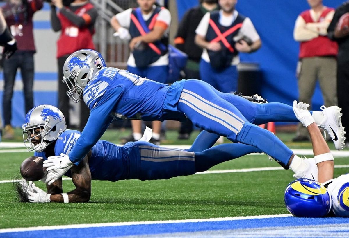 Jan 14, 2024; Detroit, Michigan, USA; Detroit Lions cornerback Cameron Sutton (1) and linebacker Jalen Reeves-Maybin (42) break up a pass during the first half of a 2024 NFC wild card game against the Los Angeles Rams at Ford Field.
