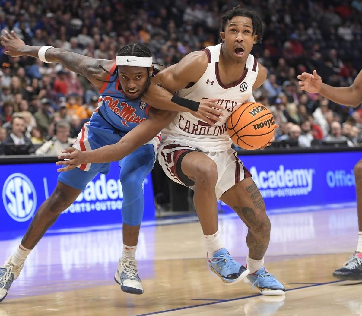 Mar 8, 2023; Nashville, TN, USA;  South Carolina Gamecocks guard Meechie Johnson (5) drives past Mississippi Rebels guard Amaree Abram (1) during the second half at Bridgestone Arena.