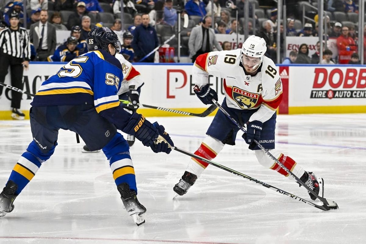 Jan 9, 2024; St. Louis, Missouri, USA;  Florida Panthers left wing Matthew Tkachuk (19) controls the puck as St. Louis Blues defenseman Colton Parayko (55) defends during the third period at Enterprise Center.