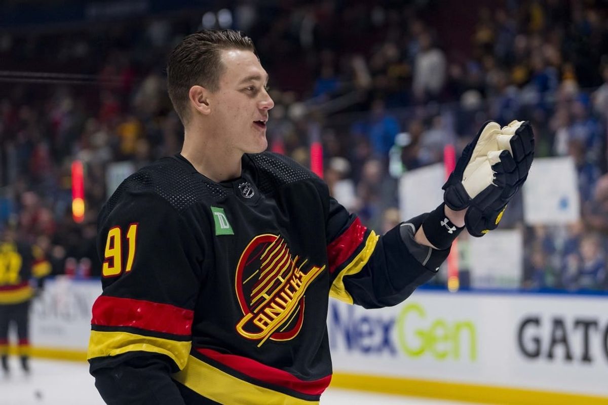 Jan 22, 2024; Vancouver, British Columbia, CAN; Vancouver Canucks defenseman Nikita Zadorov (91) waves to the fans during warm up prior to a game against the Chicago Blackhawks at Rogers Arena.