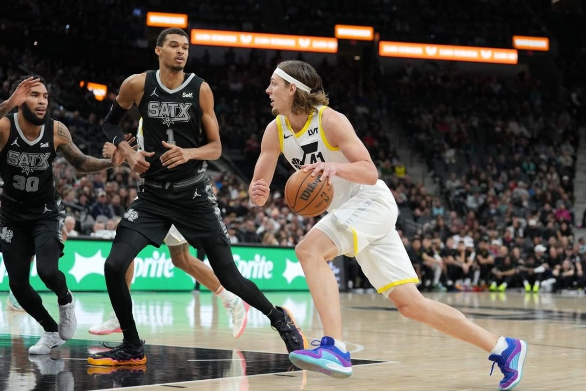 Dec 26, 2023; San Antonio, Texas, USA; Utah Jazz forward Kelly Olynyk (41) drives to the basket against San Antonio Spurs center Victor Wembanyama (1) in the first half at the Frost Bank Center.