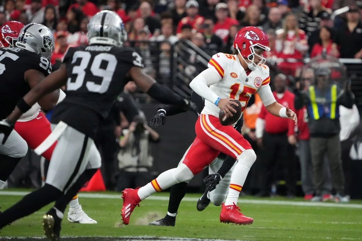 Nov 26, 2023; Paradise, Nevada, USA; Kansas City Chiefs quarterback Patrick Mahomes (15) carries the ball against the Las Vegas Raiders in the first half at Allegiant Stadium.
