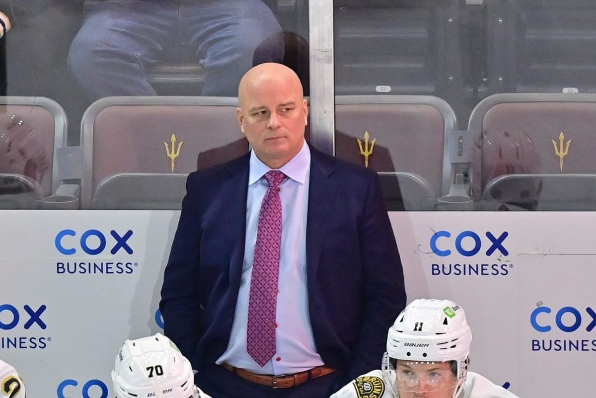 Jan 9, 2024; Tempe, Arizona, USA; Boston Bruins head coach Jim Montgomery looks on in the first period against the Arizona Coyotes at Mullett Arena.