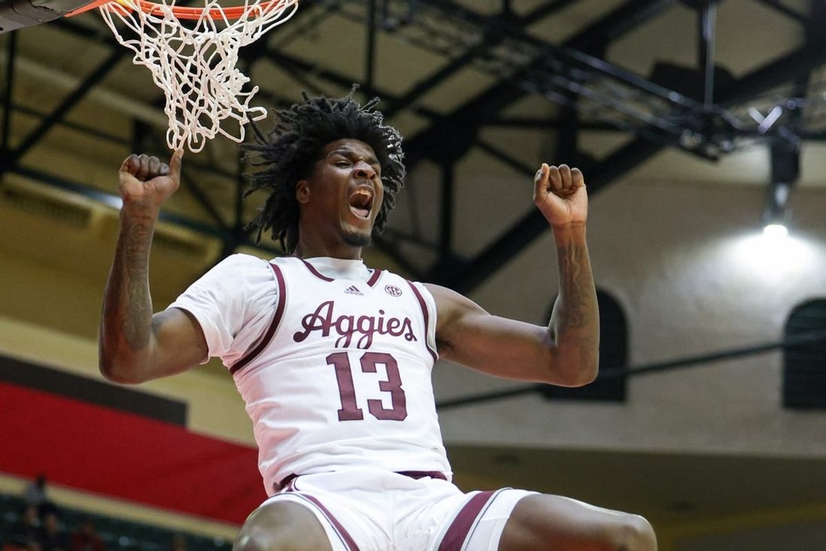 Nov 23, 2023; Kissimmee, FL, USA;  Texas A&M Aggies forward Solomon Washington (13) dunks the ball against the Penn State Nittany Lions in the second half during the ESPN Events Invitational at State Farm Field House.