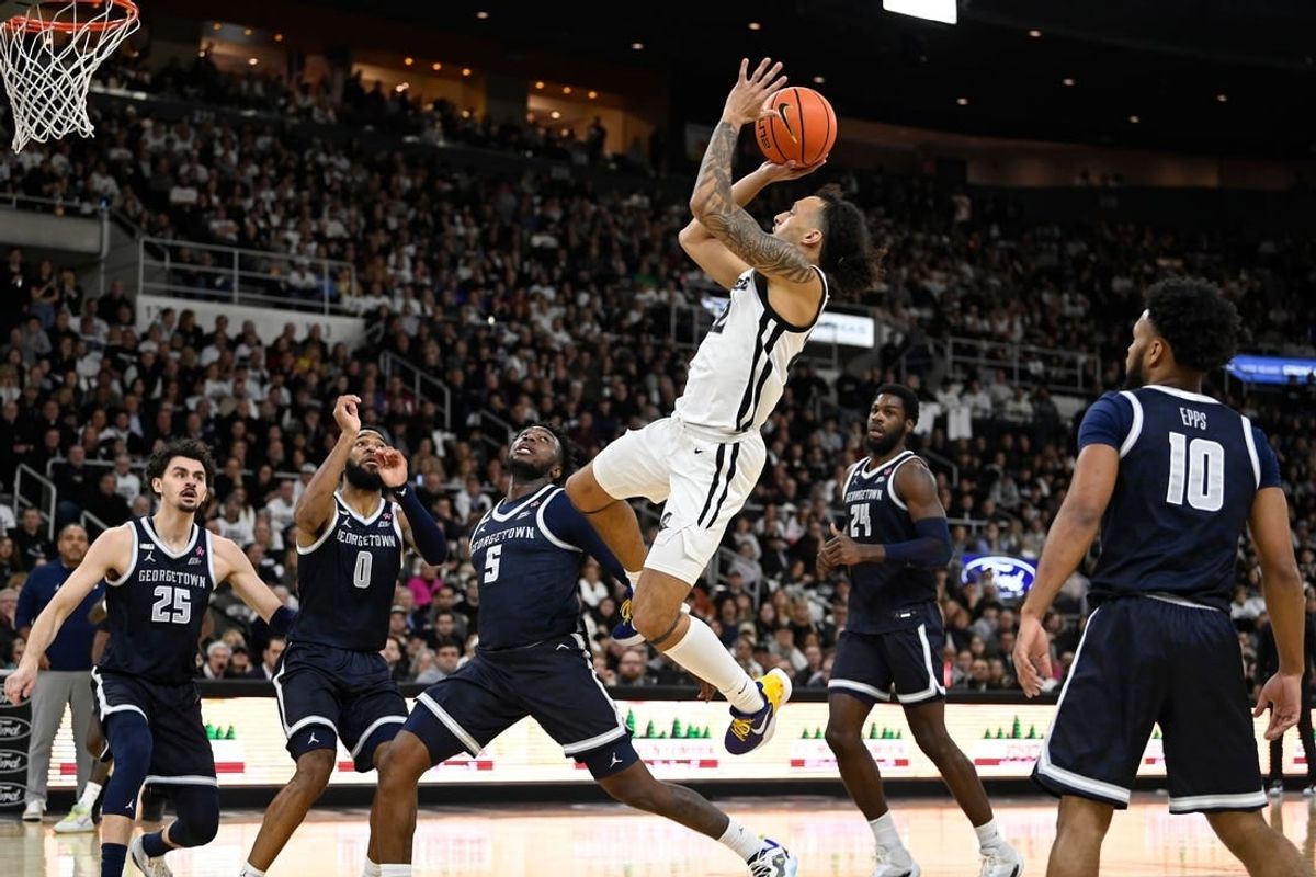 Jan 27, 2024; Providence, Rhode Island, USA; Providence Friars guard Devin Carter (22)  shoots during the first half against the Georgetown Hoyas at Amica Mutual Pavilion.