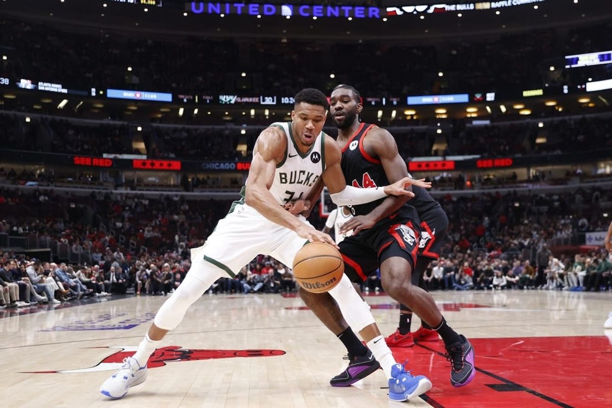 Nov 30, 2023; Chicago, Illinois, USA; Milwaukee Bucks forward Giannis Antetokounmpo (34) drives to the basket against Chicago Bulls forward Patrick Williams (44) during the first half at United Center.