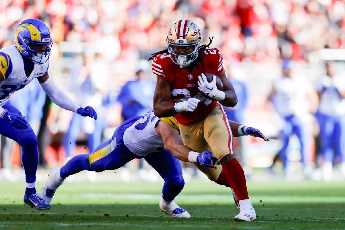 Jan 7, 2024; Santa Clara, California, USA; San Francisco 49ers running back Jordan Mason (24) runs with the ball during the second quarter against the Los Angeles Rams at Levi's Stadium.