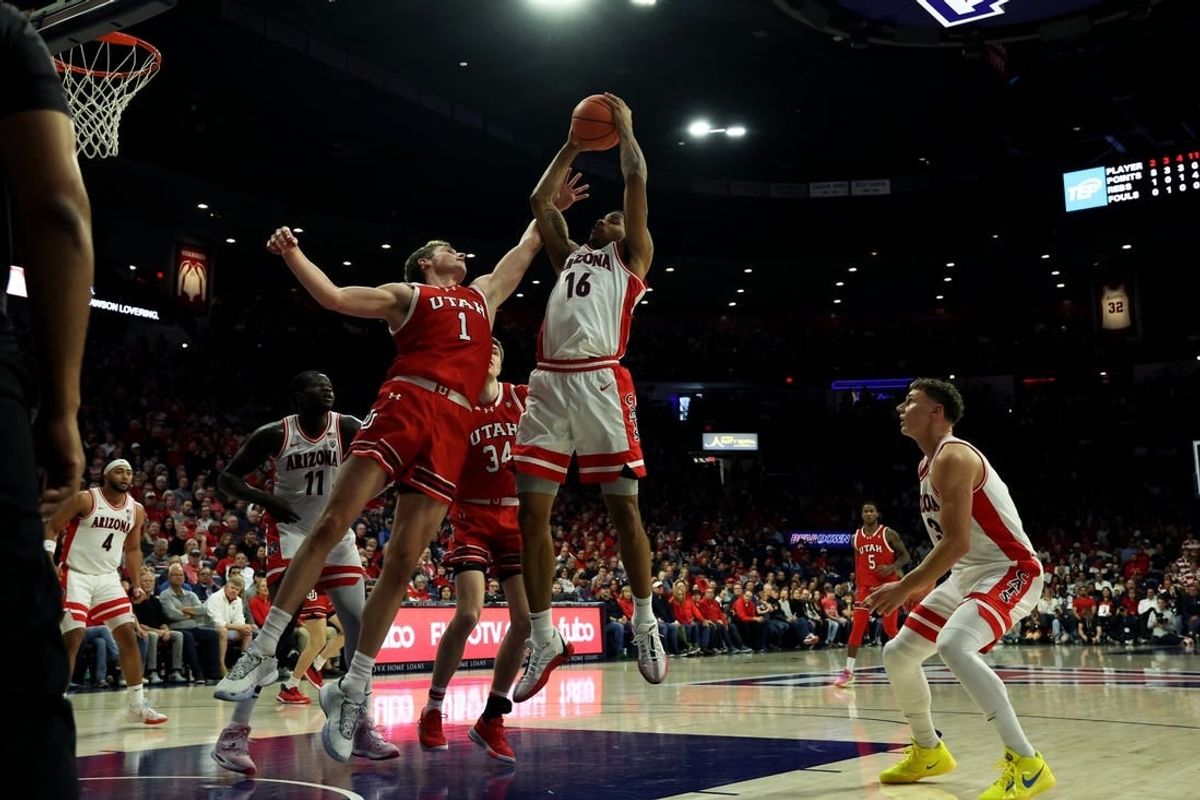 Jan 6, 2024; Tucson, Arizona, USA; Arizona Wildcats forward Keshad Johnson (16) grabs a rebound against Utah Utes forward Ben Carlson (1) during the first half at McKale Center.