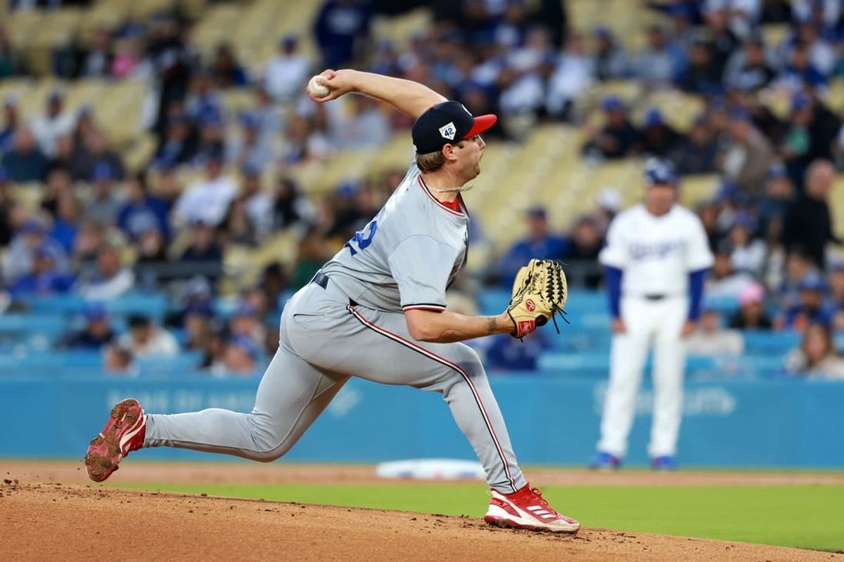 Apr 15, 2024; Los Angeles, California, USA;  Washington Nationals pitcher Mitchell Parker (42) pitches during the first inning against the Los Angeles Dodgers at Dodger Stadium. All players wore #42 in honor of Jackie Robinson Day.