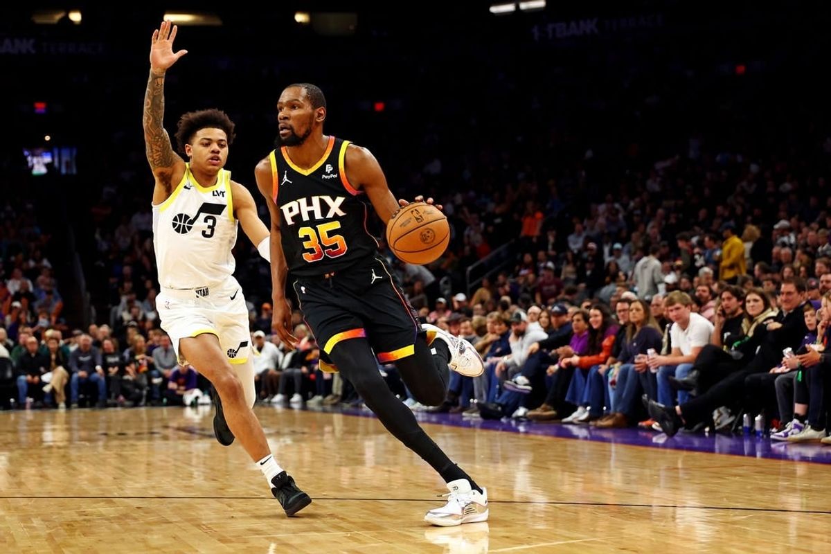 Feb 8, 2024; Phoenix, Arizona, USA; Phoenix Suns forward Kevin Durant (35) drives to the basket against Utah Jazz guard Keyonte George (3) during the third quarter at Footprint Center.