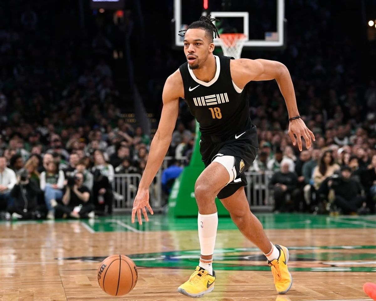 Feb 4, 2024; Boston, Massachusetts, USA; Memphis Grizzlies forward Tosan Evbuomwan (18) dribbles the ball against the Boston Celtics during the second half at TD Garden.