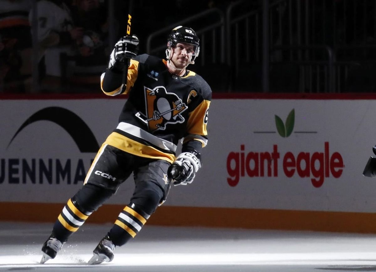 Jan 15, 2024; Pittsburgh, Pennsylvania, USA;  Pittsburgh Penguins center Sidney Crosby (87) reacts after being named a star of the game against the Seattle Kraken at PPG Paints Arena.