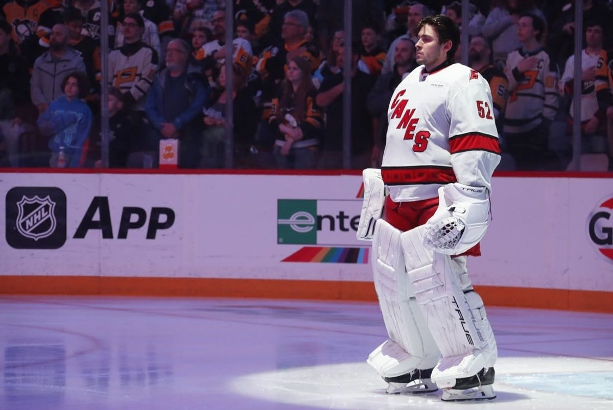 Mar 26, 2024; Pittsburgh, Pennsylvania, USA;  Carolina Hurricanes goaltender Pyotr Kochetkov (52) stands for the national anthem against the Pittsburgh Penguins at PPG Paints Arena.