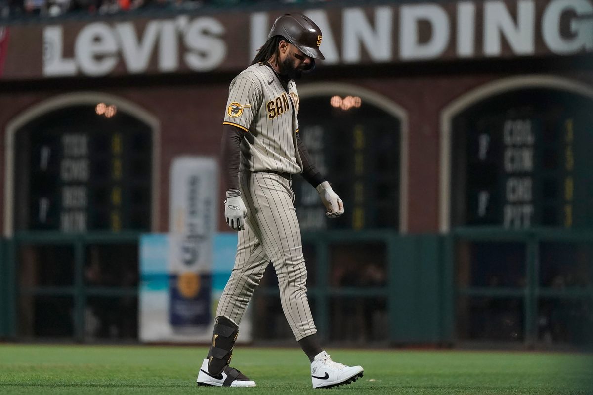 Fernando Tatis Jr. walks to the dugout after grounding out during the seventh inning