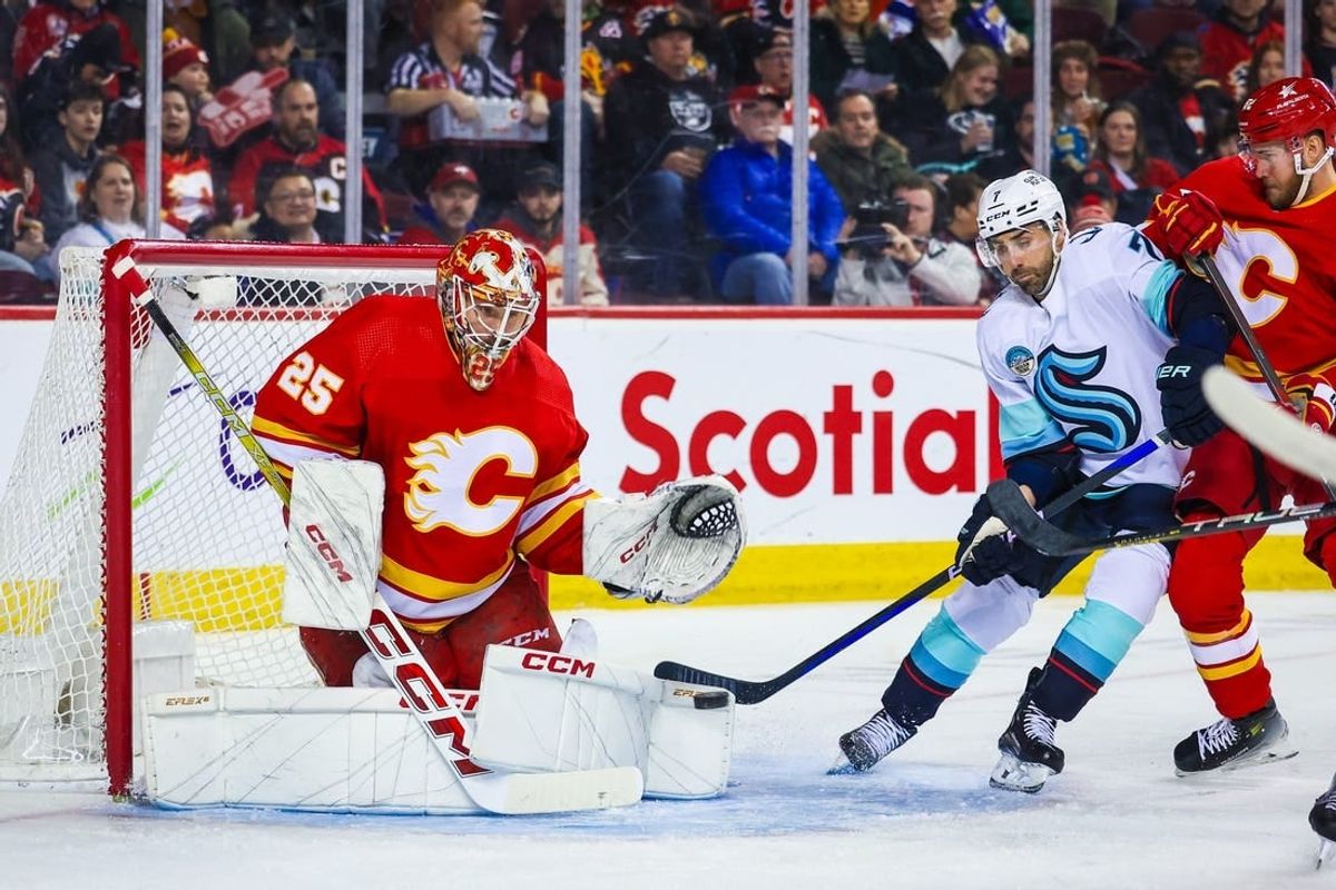 Mar 4, 2024; Calgary, Alberta, CAN; Calgary Flames goaltender Jacob Markstrom (25) makes a save against the Seattle Kraken during the first period at Scotiabank Saddledome.