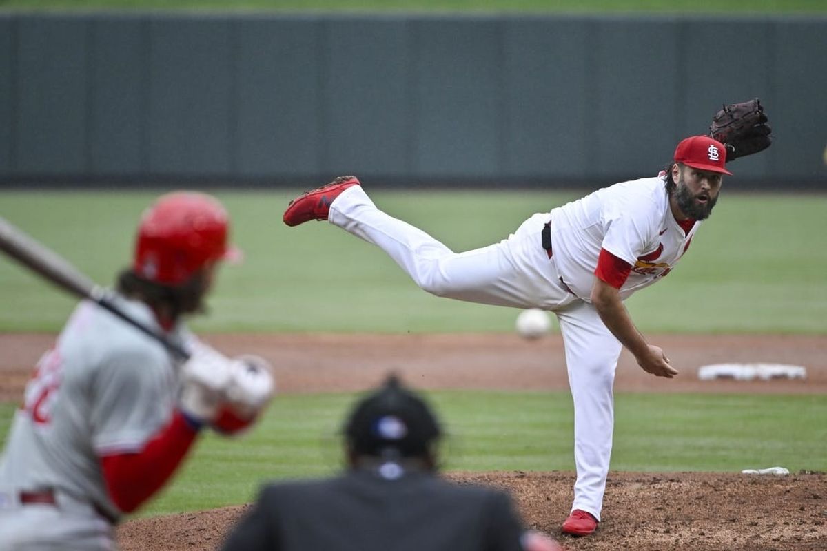 Apr 10, 2024; St. Louis, Missouri, USA;  St. Louis Cardinals starting pitcher Lance Lynn (31) pitches against Philadelphia Phillies third baseman Alec Bohm (28) during the third inning at Busch Stadium.