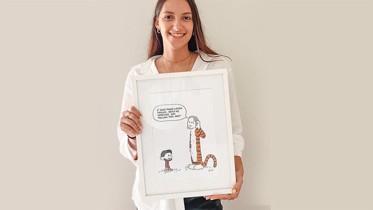 Artist Rita Carvalho holds her favorite drawing of Jimmy Garappolo.