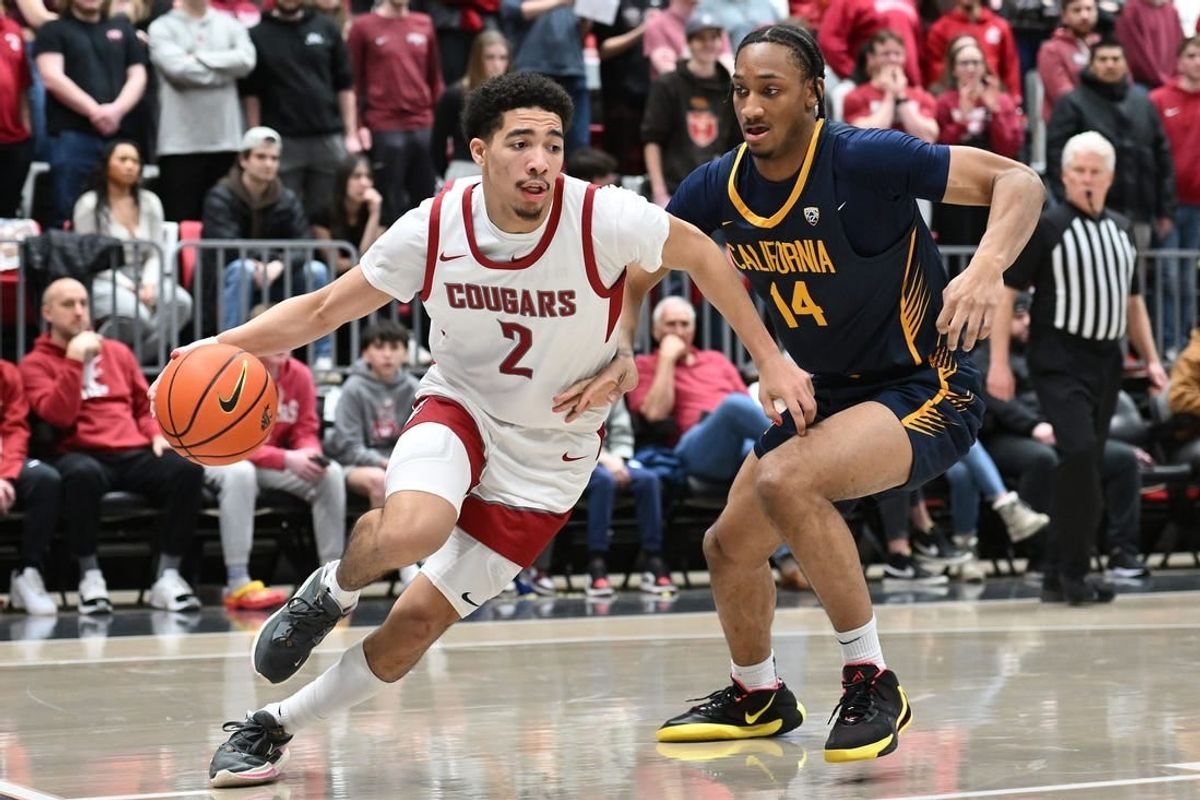 Feb 15, 2024; Pullman, Washington, USA; Washington State Cougars guard Myles Rice (2) runs the baseline against California Golden Bears forward Grant Newell (14) in the second half at Friel Court at Beasley Coliseum. Washington State Cougars won 84-65.