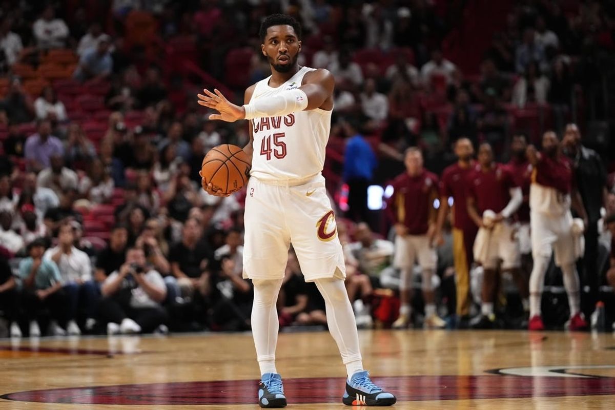 Dec 8, 2023; Miami, Florida, USA; Cleveland Cavaliers guard Donovan Mitchell (45) stands with the ball on the court during the second half against the Miami Heat at Kaseya Center.