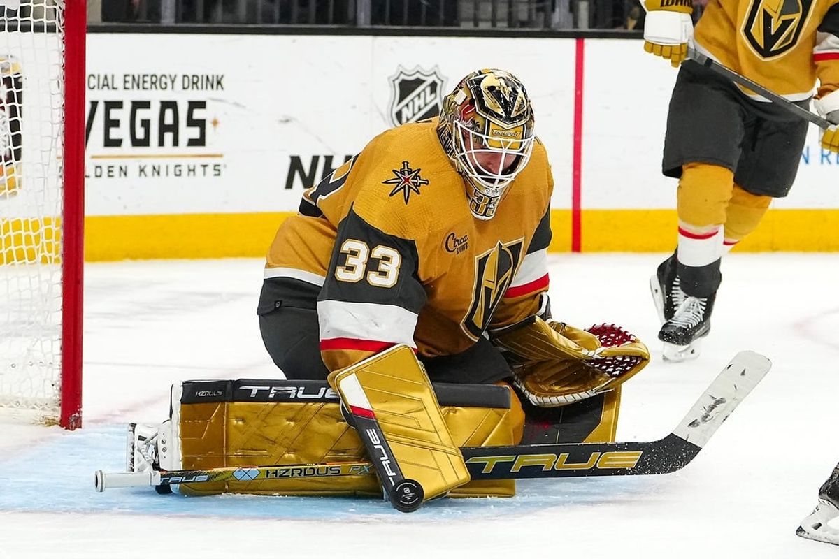 Mar 7, 2024; Las Vegas, Nevada, USA; Vegas Golden Knights goaltender Adin Hill (33) makes as save against the Vancouver Canucks during the third period at T-Mobile Arena.