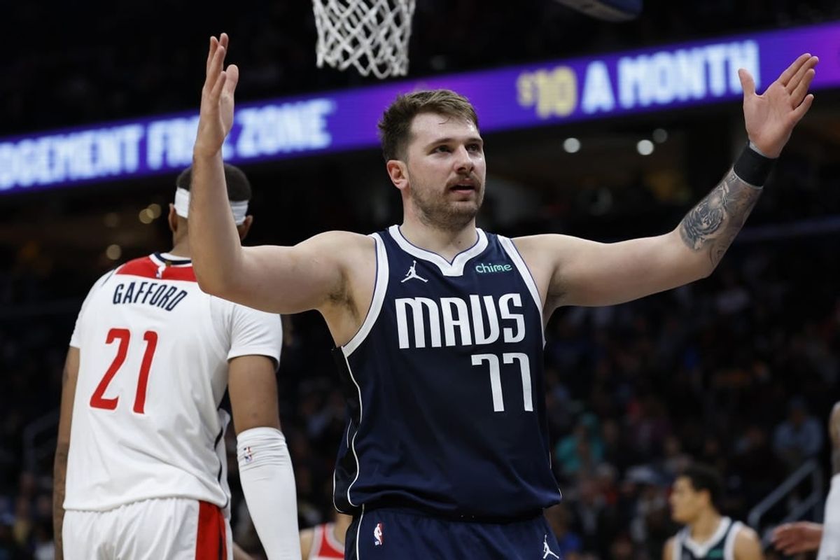 Nov 15, 2023; Washington, District of Columbia, USA; Dallas Mavericks guard Luka Doncic (77) gestures after scoring against the Washington Wizards in the second quarter at Capital One Arena.