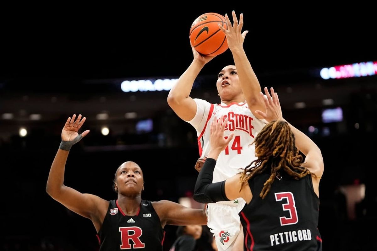 Jan 11, 2024; Columbus, Ohio, USA; Ohio State Buckeyes forward Taiyier Parks (14) shoots over Rutgers Scarlet Knights guard Mya Petticord (3) and Rutgers Scarlet Knights center Chyna Cornwell (54) during the second half of the NCAA women   s basketball game at Value City Arena. Ohio State won 90-55.