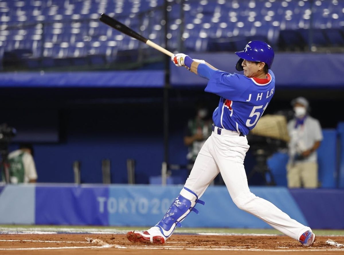 Jul 31, 2021; Yokohama, Japan; Team South Korea outfielder Jung Hoo Lee (51) hits a single against USA during the Tokyo 2020 Olympic Summer Games at Yokohama Baseball Stadium.